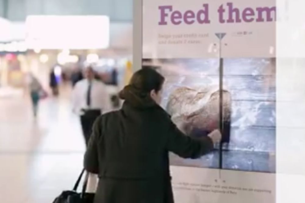 Kapitalizam s ljudskim likom: Provucite karticu i nahranite decu Trećeg sveta! (VIDEO)