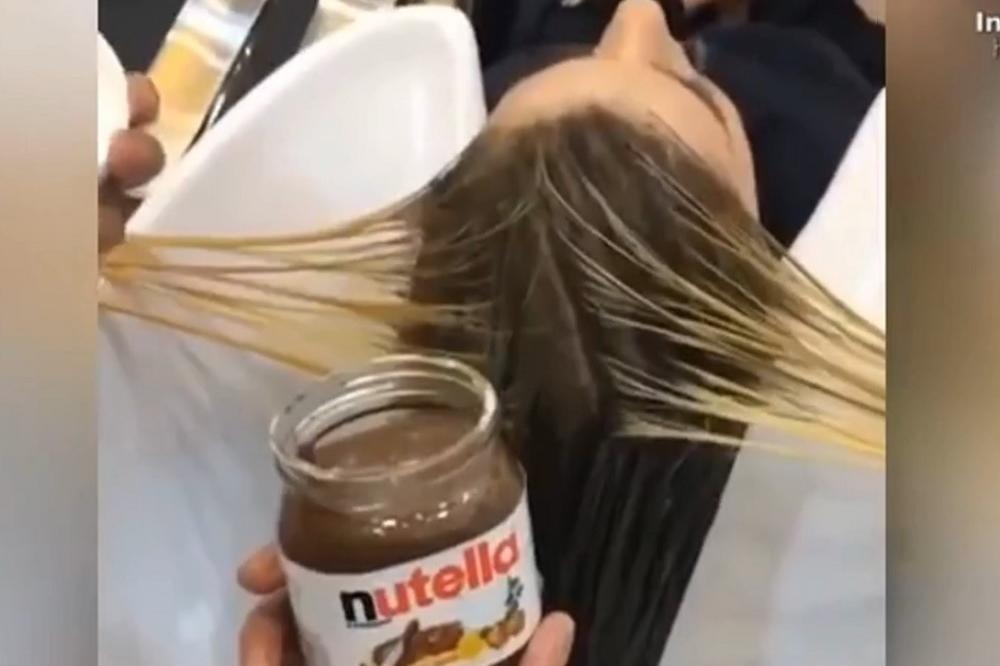 Zašto ovaj lik maže ženi nutelu po kosi?! Razlog i nije toliko blesav kako izgleda! (VIDEO)