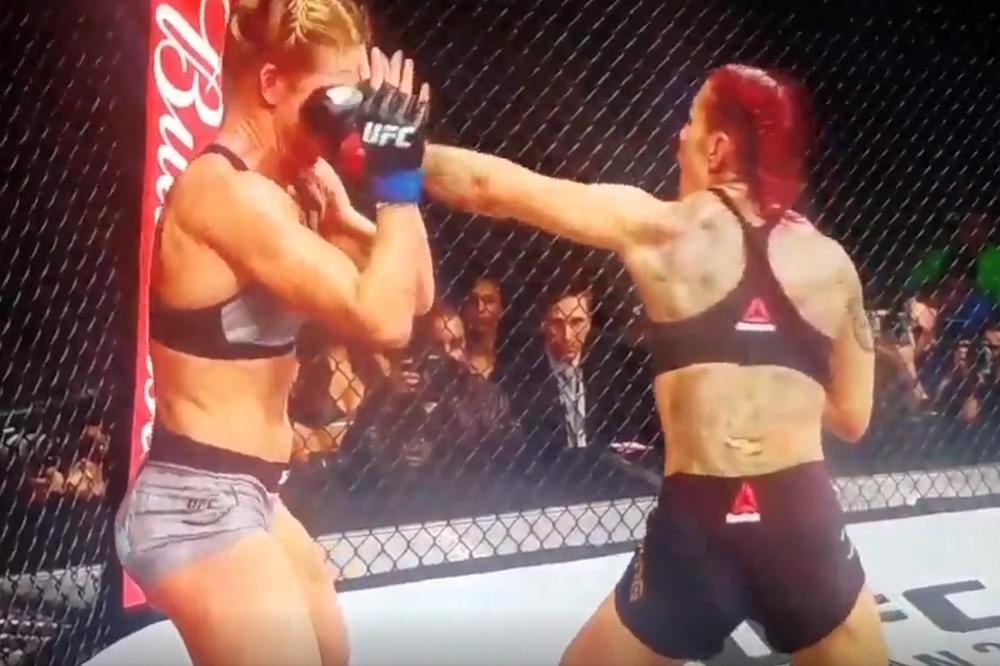 BATINANJE NA ŽENSKI NAČIN! Kiborg prebila Holmovu, krv letela na sve strane! (VIDEO)