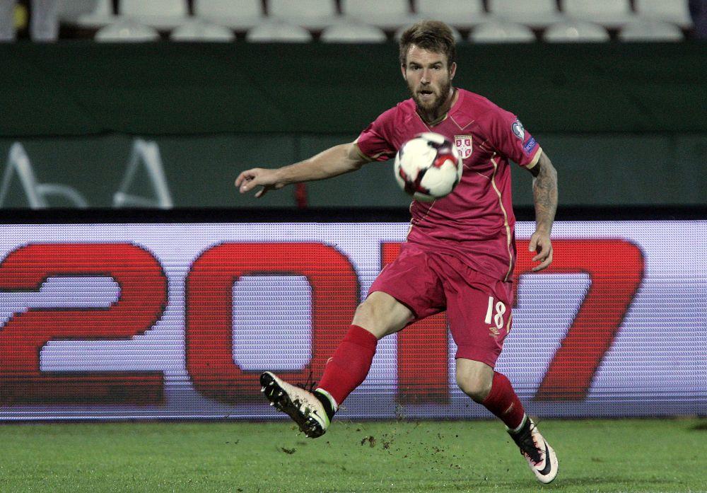 Aleksandar Katai u dresu sa državnog grbom  