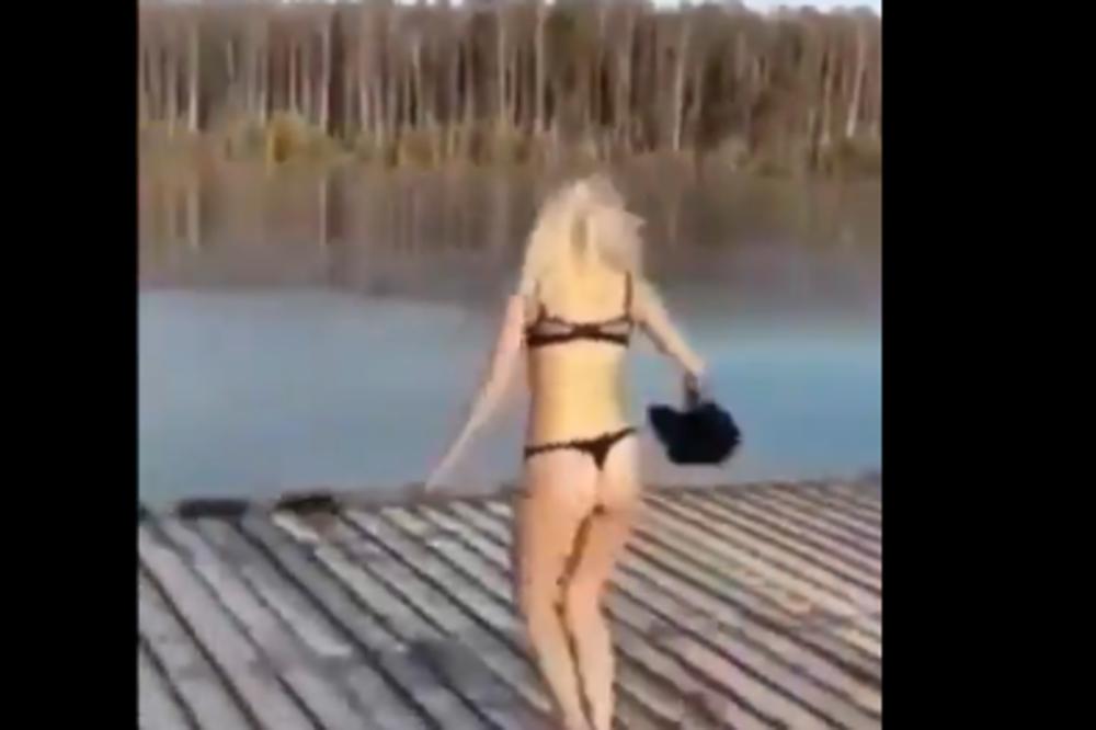 KAO IZ VICA O PLAVUŠAMA: Potrčala je da skoči u jezero, ali je izgleda zaboravila koje je godišnje doba! (VIDEO)