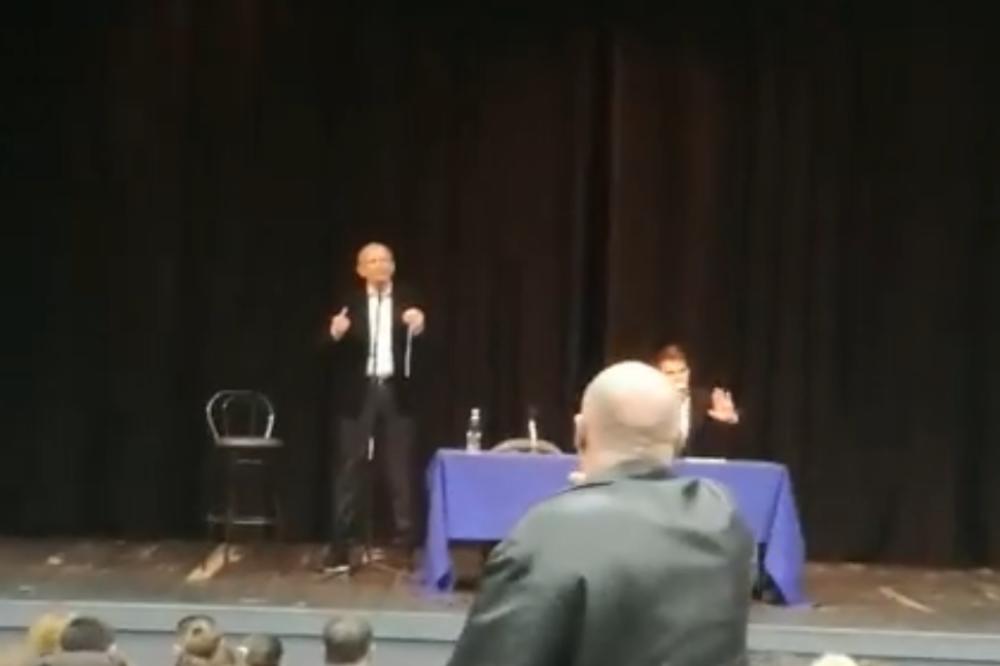 RATNI ZLOČINAC U ZAGREBU DRŽAO PREDAVANJE O BOGU! Mladi uleteli da protestvuju, publika ih napala! (VIDEO)