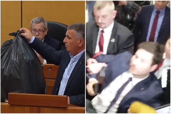NA PLENKOVIĆEVO MESTO STAVILI VREĆU SMEĆA, POSLANIKA IZNELO OBEZBEĐENJE: Haos OPOZICIJE u hrvatskom Saboru (VIDEO)