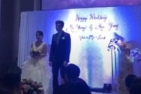 ŠOK NA SVADBI! Sve je bilo lepo, a onda se iza mladenaca pojavio SRAMNI SNIMAK! Otkrivena njena tajna (VIDEO)