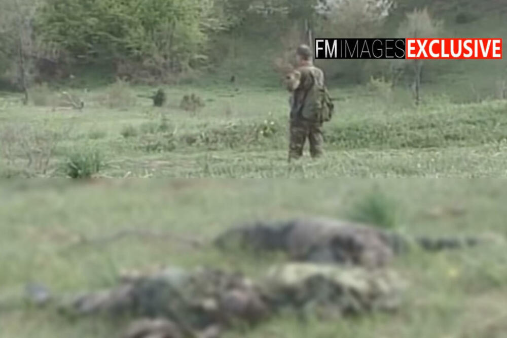 PRIPADNICI OVK GAZE TELA VOJNIKA SA KOŠARA! Jedni stražare, drugi im kopaju rake (UZNEMIRUJUĆI VIDEO)