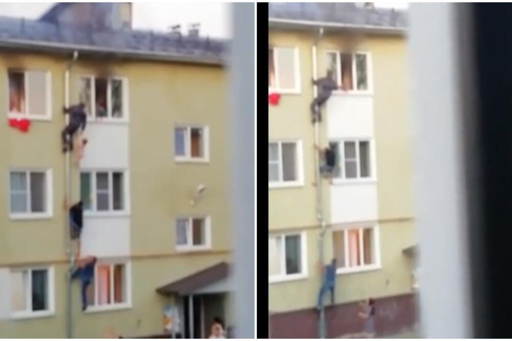 SNIMAK IZVLAČENJA DECE IZ POŽARA U STANU NA TREĆEM SPRATU! Tri muškarca HEROJSKI izvukla dvoje mališana (VIDEO)