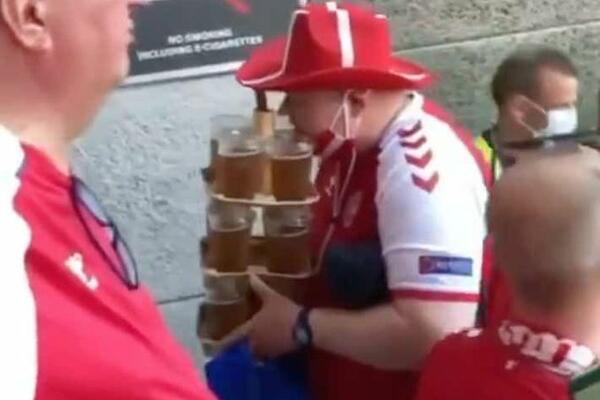 PRAVI PROFESIONALAC: Danski navijač se popeo na tribine Parken stadiona sa 12 čaša piva u rukama + HOT DOG!