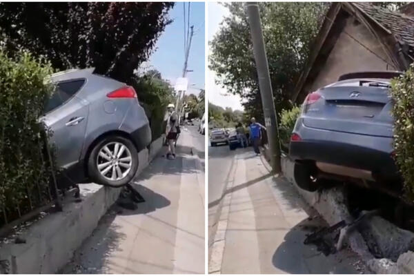 ODVALIO ULIČNU OGRADU I UPAO U DVORIŠTE KUĆE: Automobil bukvalno visi na ogradi na Belim Vodama (VIDEO)