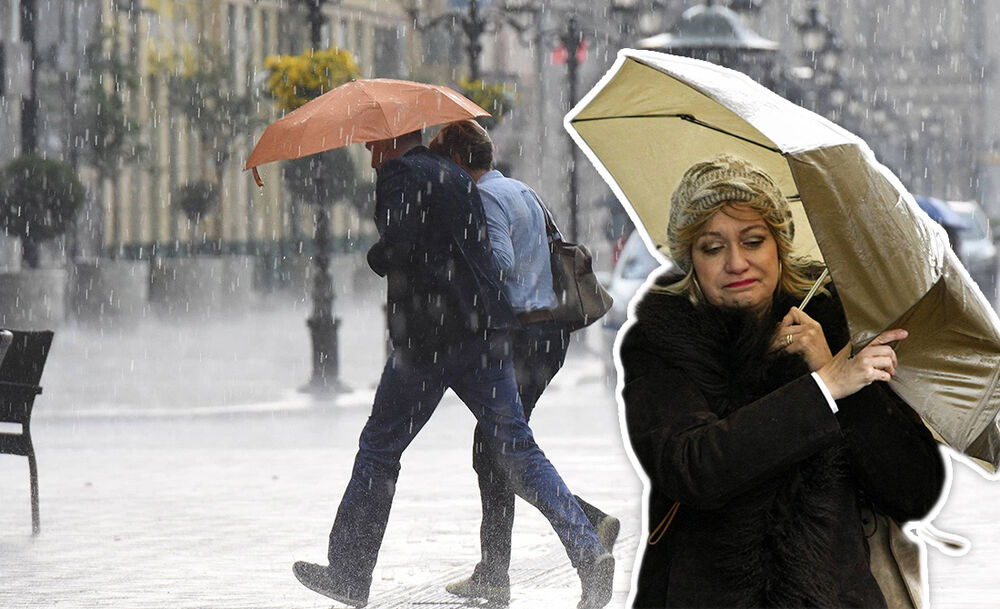 Ljudi šetaju po kiši
