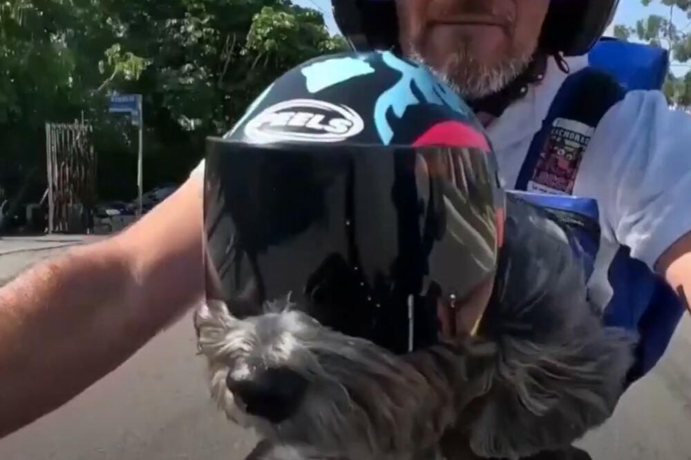 OVAJ ČOVEK I NJEGOV PAS ČINE PRELEPU STVAR: Voze se na MOTOCIKLU po gradu, a ono što rade će vas ODUŠEVITI (VIDEO)