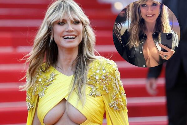 I SA 50 GODINA IZGLEDA KAO BOMBA: Poznata manekenka šetala GOLIH GRUDI na trci Formule 1! (VIDEO)