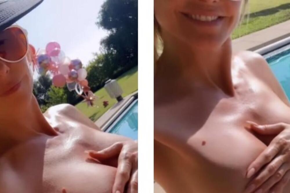 Evo kako plavuša slavi 1. maj! Dole tange, a gornji deo zaboravila - tračica jedva nešto prekrila, a komšije zevaju