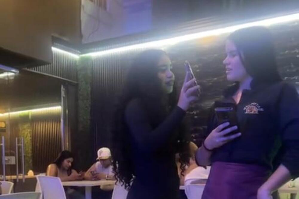 DA SE PREKRSTIŠ I LEVOM I DESNOM! Optužila konobaricu da joj muva dečka, pa nasrnula na nju pred svima! (VIDEO)